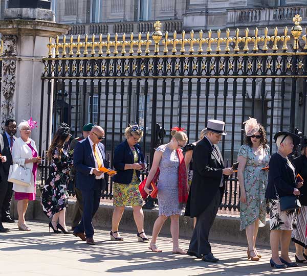 Guests arriving for the Queen's Garden Party at Buckingham Palace